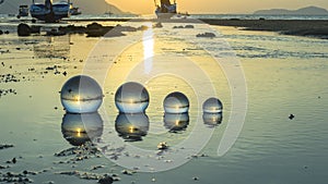 Time lapse crystal ball placed on the beach