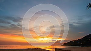 time lapse day to night colorful bright sky in sunset above Karon beach Phuket..