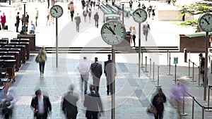 Time lapse footage of clock faces and people commuting, Docklands, London