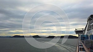 Time lapse footage of cruise ship cruising in the Japan ocean island in sunset sky.