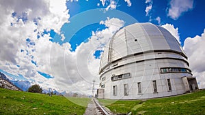 Time-lapse with huge observatory against sky