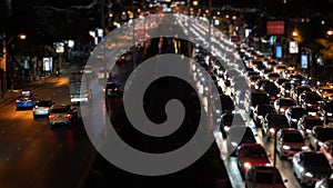 Time-lapse A huge traffic jam on the busy avenue at night time rush hour