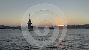 Time lapse of Istanbul Maiden Tower kiz kulesi at sunset on the entrance to Bosporus Strait in Istanbul, Turkey.