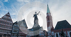 Time lapse Lady Justice statue in Old town Romerberg square Frankfurt, Germany
