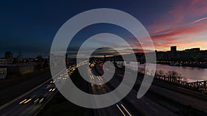 Time Lapse of Long Exposure Freeway Traffic and Train Along Willamette River with Portland Oregon Cityscape at Sunset 1080p