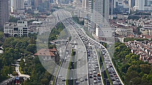 Time lapse,long heavy traffic on highway,Shanghai business building skyscraper.