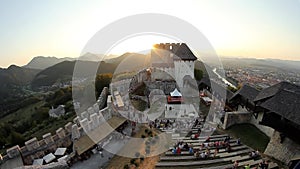 Time lapse of medieval games attendees with the castle in the background