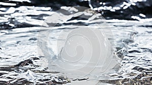 Time lapse. Melting ice cube. Ice turns into water.