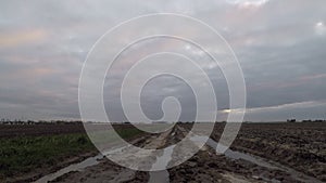 Time lapse of motion of wave clouds over a country road in a desolate environment