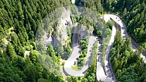 Time-lapse in mountain pass, speeding car on curvy mountain road