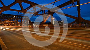 Time Lapse Movie of Long Exposure Light Trails During Peak Hour Road Traffic on Broadway Bridge from Daylight into Blue Hour