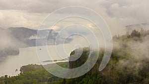 Time lapse of moving low clouds and fog along Columbia River Gorge and over historic Vista House in Portland OR 4k