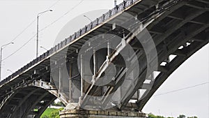 Time lapse old bridge over the river for cars in the rain