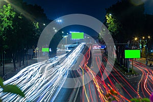 Time lapse photo at Nguyen Thai Son overpass, Ho Chi Minh city with billboards with green background