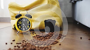 Time lapse retro clock with alarm clock,plastic cup of coffee,fast moving hands on the clock,close-up.Coffee beans