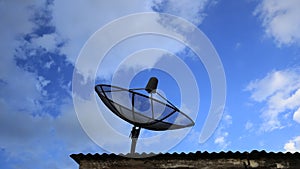 Time-lapse of Satellite dish with blue sky and cloud background