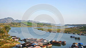 The time-lapse scenery of floating houses and river at Sangkhlaburi District, Kanchanaburi Province, Thailand
