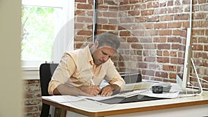 Time Lapse Sequence Of Businessman Working At Desk In Office