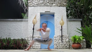 Time Lapse Sequence Of Senior Man Doing Tai Chi Exercises