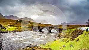 Time lapse of the Sligachan Old stone Bridge over River Sligachan with Beinn Dearg Mhor and Marsco peak of Red Cuillin