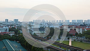 Time lapse of sun rising over public transportation in Eunos Singapore closeup