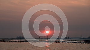 Time lapse of sunset with mist sky and Si Chang island, Sriracha, Thailand