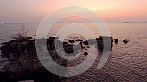 Time lapse sunset over tropical bay seen from top of mountain