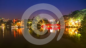 Time lapse Tourists visit Hoan Kiem Lake Public park at night time in Hanoi city.