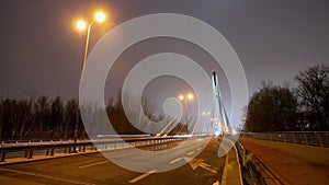 Time lapse traffic jam on city bridge road at night, roadway in modern big city in evening. Timelapse of busy highway at