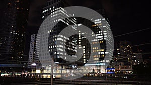 Time Lapse of Train Passing over Bridge in Central Tokyo Japan at Night