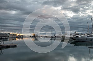 time lapse Twilight in the port of Valencia ships skyline reflected