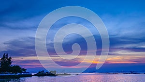 Time lapse of twilight sky at sea with little island, Chonburi, Thailand