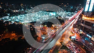 Time-lapse of under construction site, car traffic transportation on road in downtown Asia at night