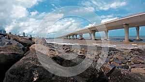 Time-lapse video of Arabian sea tides with the huge Bandra Worli sea link bridge in the background at koliwada mumbai.