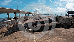 Time-lapse video of Arabian sea tides with the huge Bandra Worli sea link bridge in the background at koliwada mumbai.