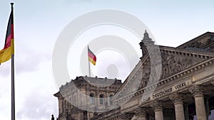 Time lapse video of flags flying outside Reichstag or Deutscher Bundestag German Parliament building in Berlin, Germany
