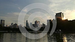 Time lapse view of Bangkok City from a distance during a beautiful golden sunset. Day to Night view.