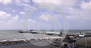 Time lapse view of Brighton pier in stormy weather