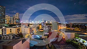 Time lapse view of Makati skyscrapers in Manila city. Skyline at night, Philippines.