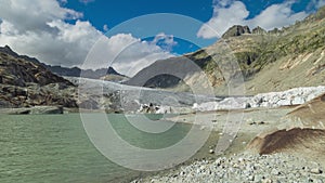 Time lapse, view of melting glacier in the Swiss Alps. Rhone Glacier, the source of the river Rhone. Furka Pass, Canton Valais,