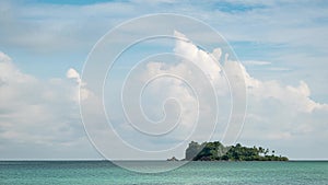 Time-lapse of viewpoint with cumulus and cirrus clouds forming above tropical islands
