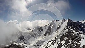 Time lapse of wickedly intense clouds roiling and flowing over peaks