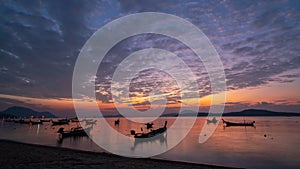 Time lapse of wooden boat Longtail fishing boats at Rawai beach Phuket Thailand Beautiful Light of nature Sunrise over sea Amazing