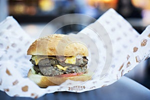 Time for lunch with big tasty burger in shopping center