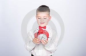 Time management. Morning. Party time. Businessman. Formal wear. tuxedo kid. Happy childhood. little boy with alarm clock