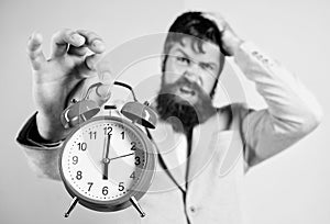 Time management skills. How much time left till deadline. Time to work. Man bearded stressful businessman hold clock