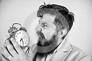 Time management skills. How much time till deadline. Time to work. Man bearded aggressive businessman hold clock. Stress