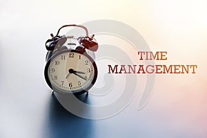 Time management, work life balance concept, alarm clock with words TIME MANAGEMENT