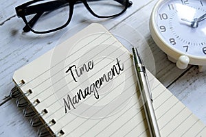 Time management written on a notebook