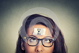 Time management. young woman with sand clock sign